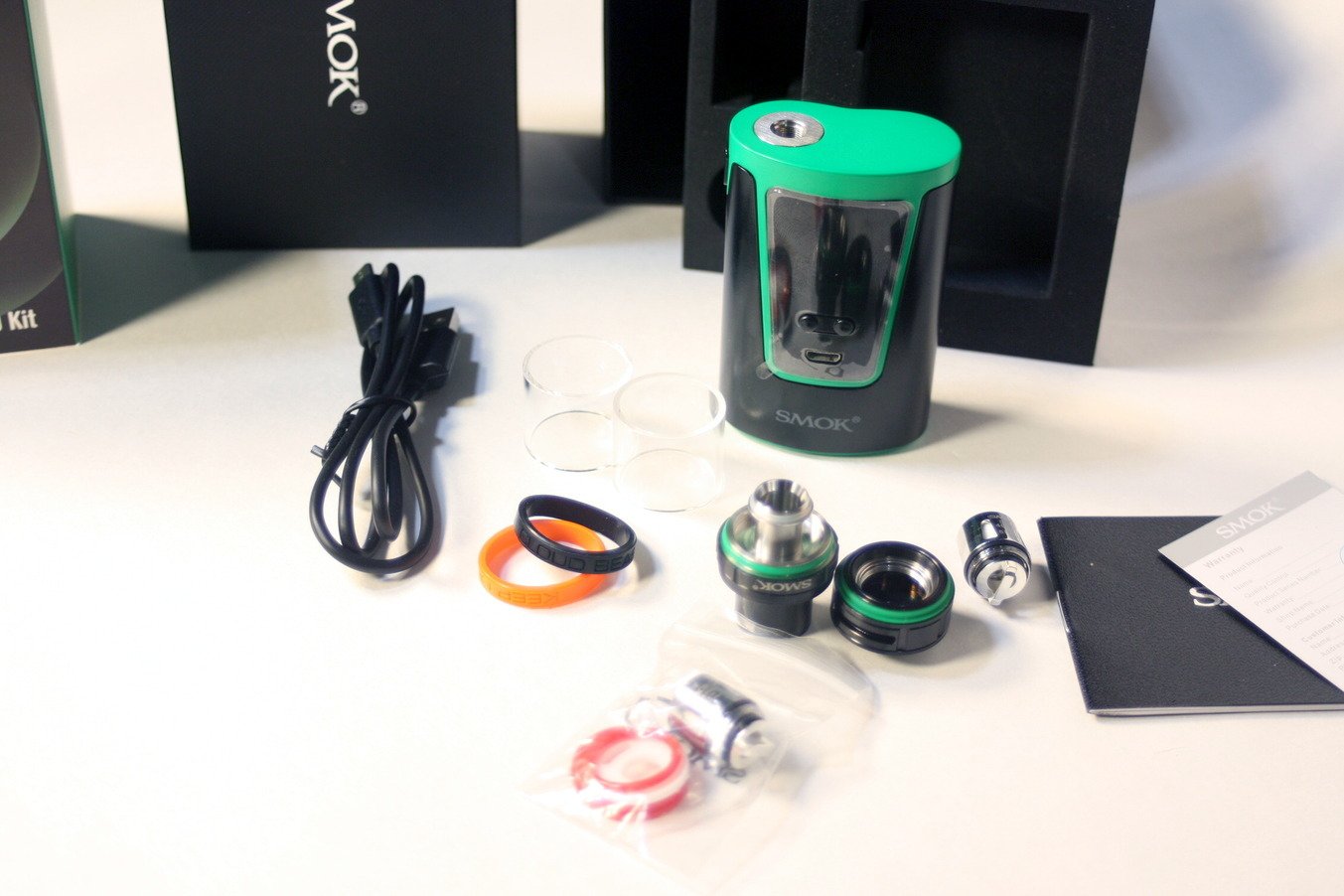 All the diassembled parts of the Smok G150 kit including  Big Baby Beast tank,  V8 coils and mod