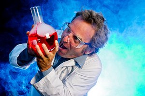 goofy scientist goofy scientist with some beakers, lab equipment and vapor in the air