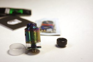 Wotofo Faris RDTA mode a shot of the Wotofo Faris BF RDTA/RDA in rtda mod with various vaping accessories