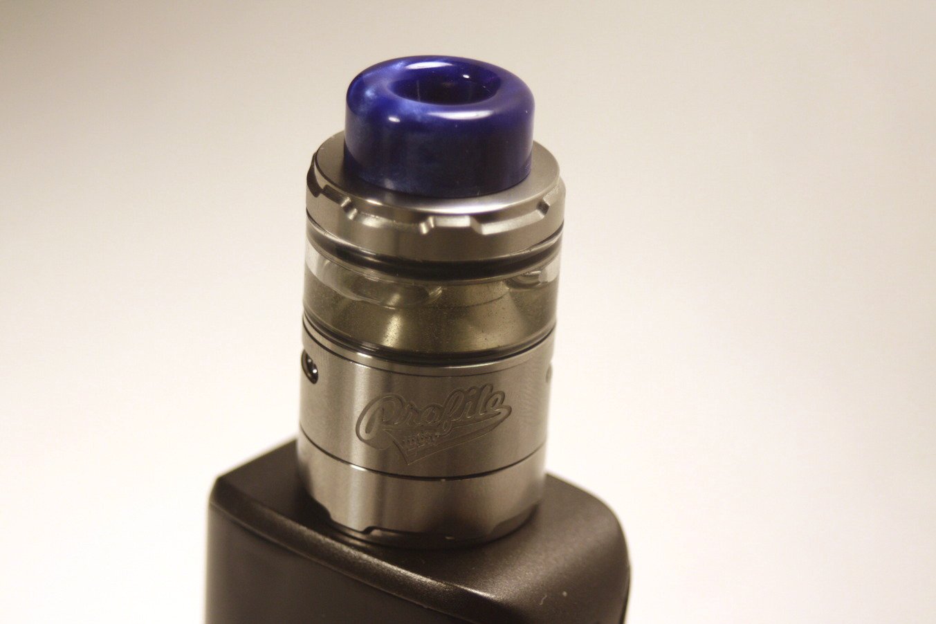 front view of the Wotofo Profile Unity RTA stainless steel with blue acrylic drip tip
